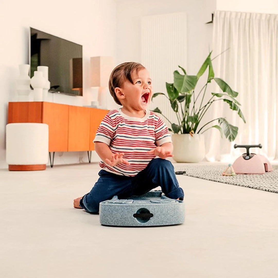 Child with Robot Vacuum