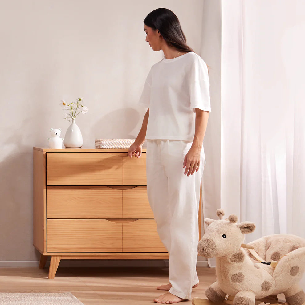 Woman beside dresser